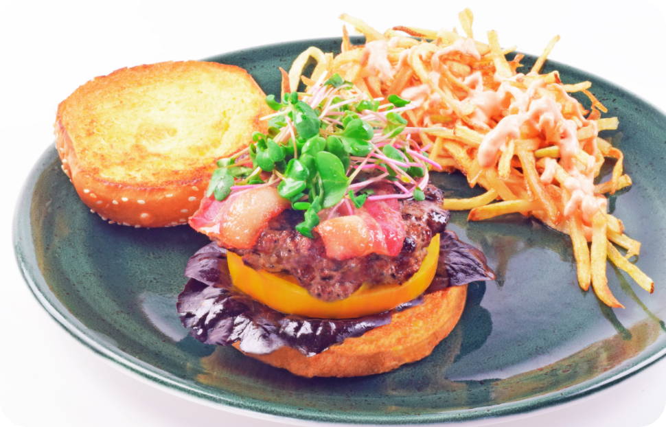 Rodeo Drive Burger on a plate with a side of fries